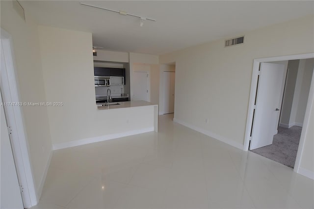 interior space with sink and track lighting