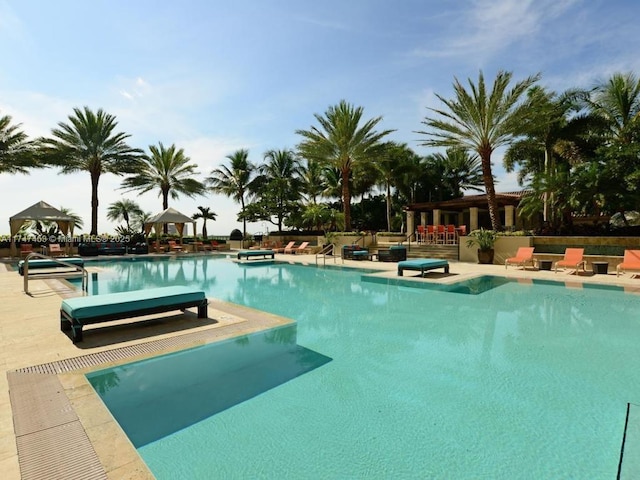 view of swimming pool featuring a patio area and a gazebo