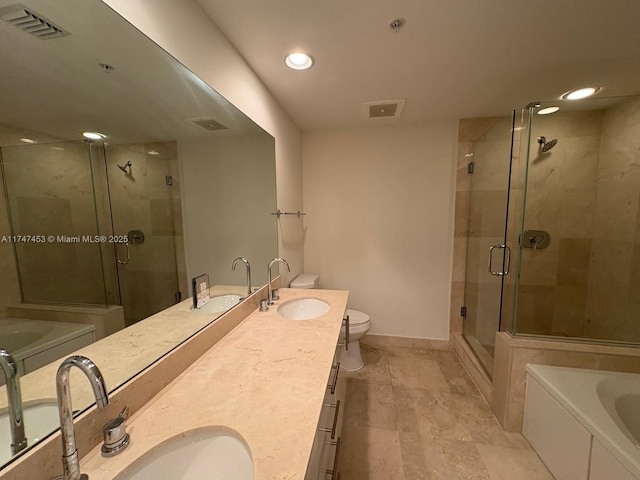 full bathroom featuring plus walk in shower, vanity, and toilet