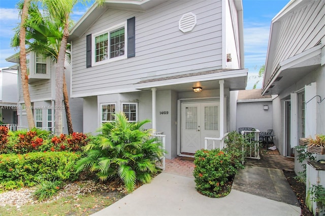 doorway to property featuring stucco siding