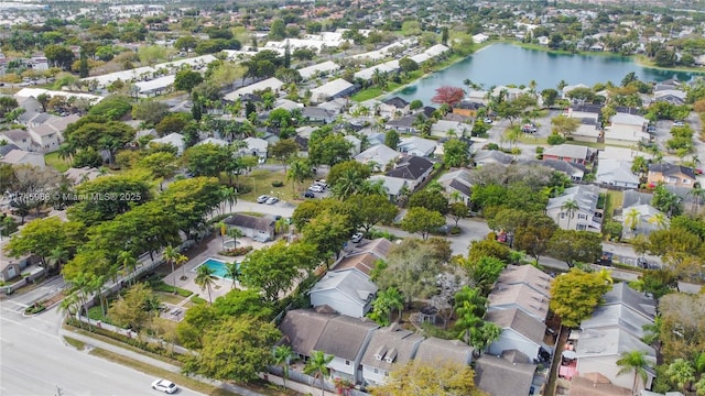 drone / aerial view featuring a water view and a residential view