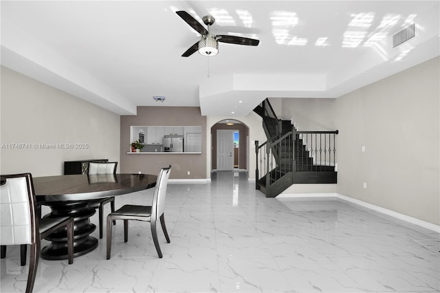 dining room featuring ceiling fan