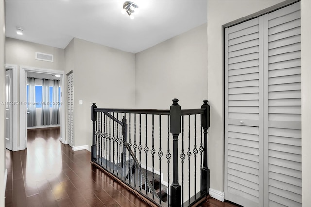 hall with dark hardwood / wood-style flooring