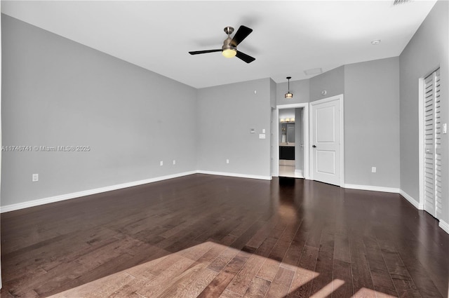 unfurnished living room with ceiling fan and dark hardwood / wood-style floors