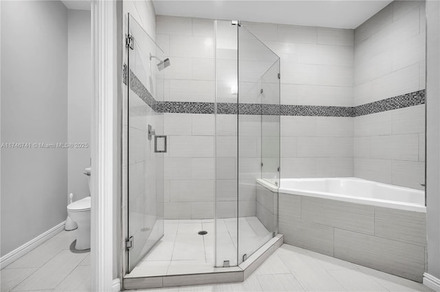 bathroom featuring tile patterned floors, plus walk in shower, and toilet