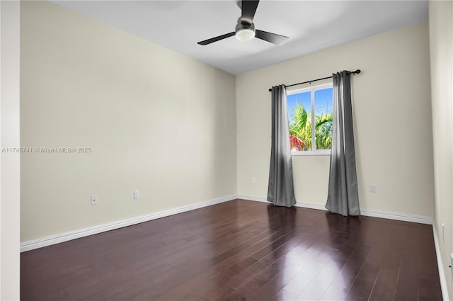 unfurnished room with dark hardwood / wood-style floors and ceiling fan