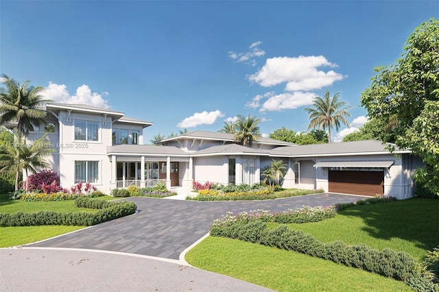 view of front facade with a front yard and a garage