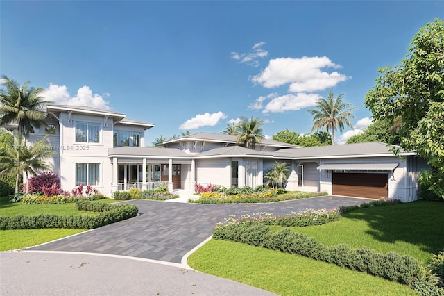 view of front of home featuring a garage, a front yard, covered porch, and driveway