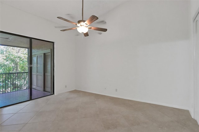 empty room with ceiling fan and light tile patterned floors