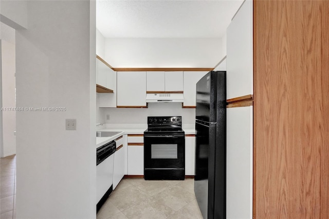 kitchen featuring light tile patterned flooring, white cabinets, sink, and black appliances