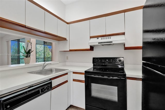 kitchen featuring sink, white cabinetry, and black appliances