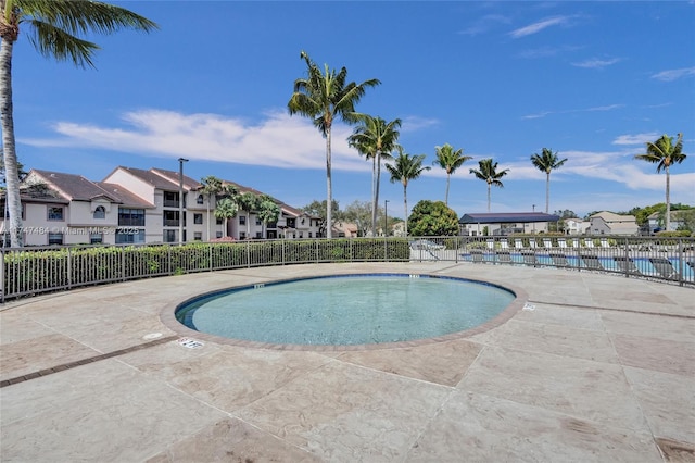 view of swimming pool with a patio area