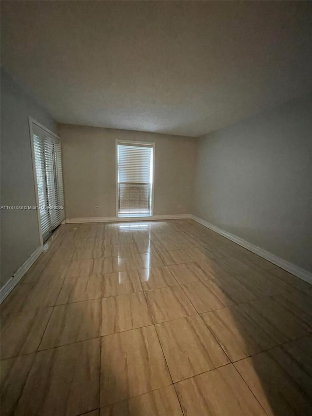 view of tiled spare room