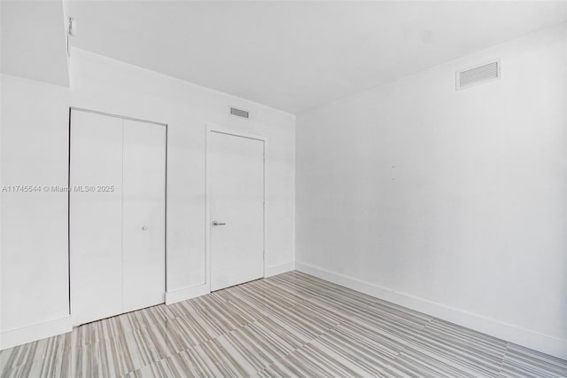 unfurnished bedroom featuring a closet