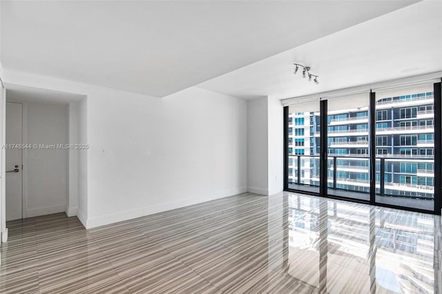 empty room with floor to ceiling windows