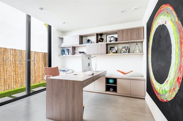 office space featuring plenty of natural light and expansive windows