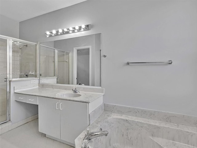 bathroom with independent shower and bath and vanity