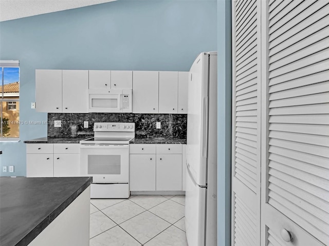 kitchen featuring backsplash, white appliances, white cabinets, and light tile patterned flooring