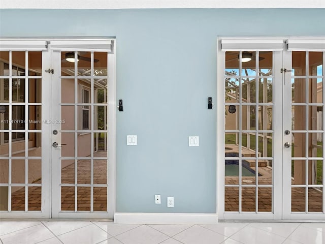 doorway with french doors and tile patterned flooring