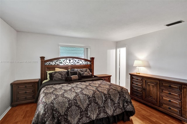 bedroom with light hardwood / wood-style flooring