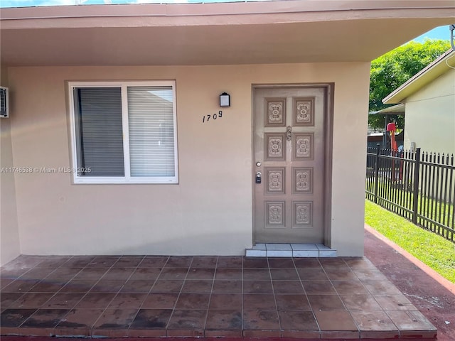 entrance to property with a patio