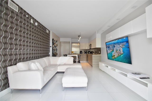 living room with light tile patterned floors