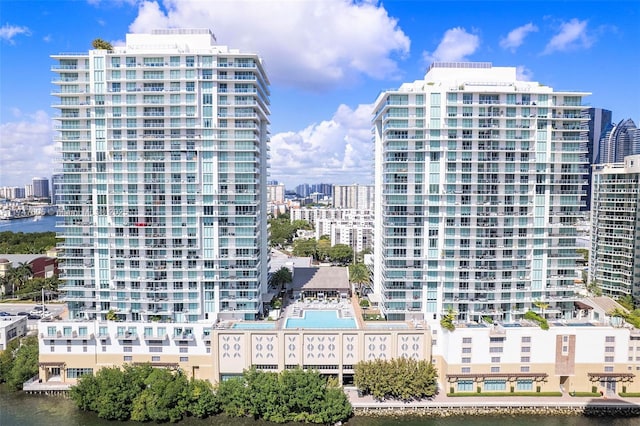 view of property with a city view and a water view