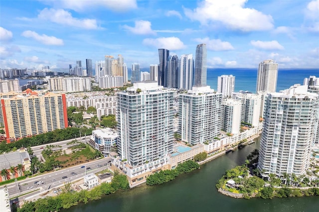 bird's eye view featuring a view of city and a water view