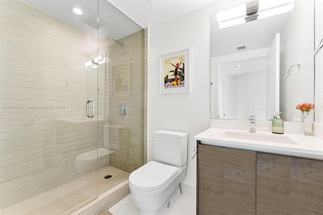 bathroom with toilet, a stall shower, visible vents, and vanity