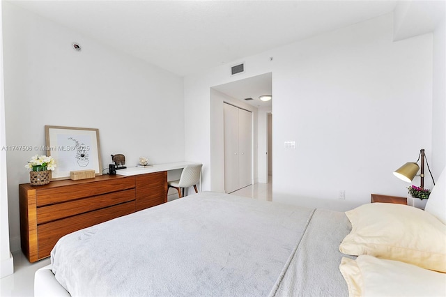 bedroom featuring visible vents