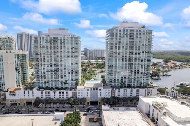 exterior space featuring a view of city and a water view