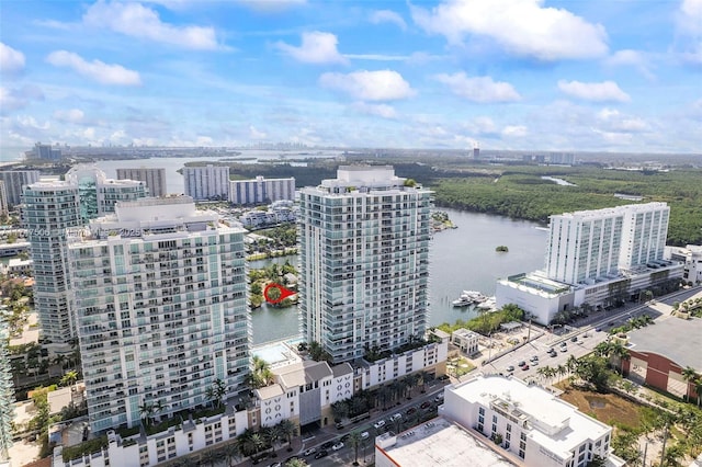 birds eye view of property featuring a view of city and a water view