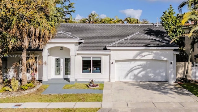 ranch-style house featuring a garage