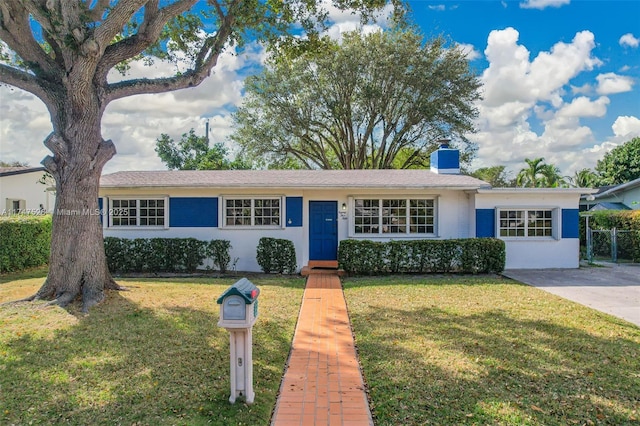 ranch-style house with a front yard