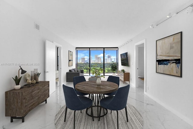 dining room with a wall of windows