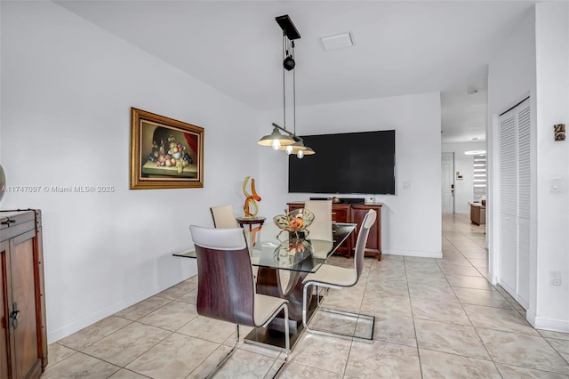 dining space with light tile patterned floors