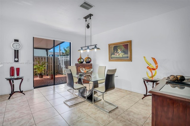 dining space with light tile patterned floors