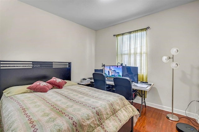 bedroom with hardwood / wood-style floors