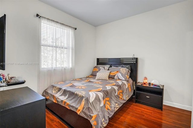 bedroom featuring dark hardwood / wood-style flooring