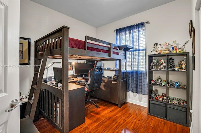 bedroom with hardwood / wood-style floors