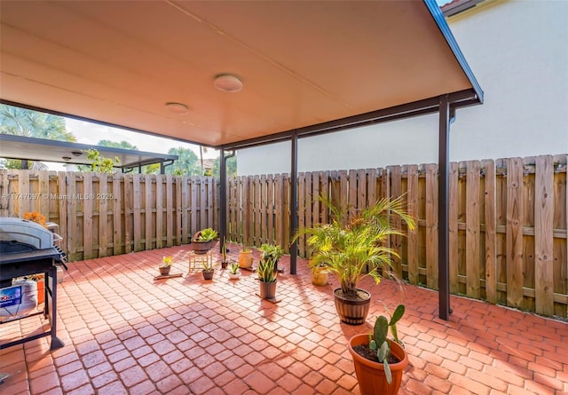 view of patio featuring a grill