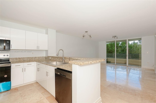 kitchen with kitchen peninsula, sink, a wall of windows, dishwasher, and stainless steel range with electric stovetop