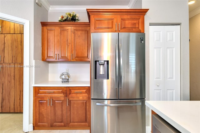 1632 NE Winterberry Ln, Weston, FL 33327 - kitchen featuring light tile patterned floors, light countertops, stainless steel fridge, and crown molding