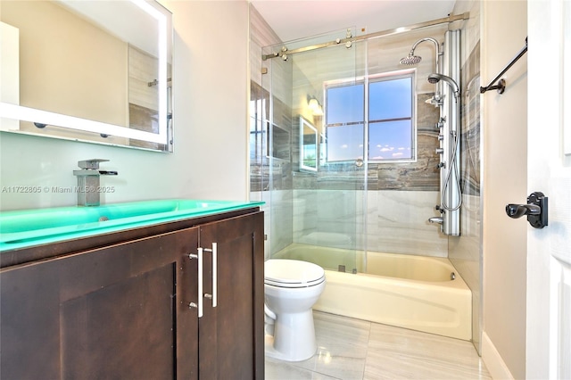 1632 NE Winterberry Ln, Weston, FL 33327 - full bathroom featuring shower / bath combination with glass door, vanity, and toilet