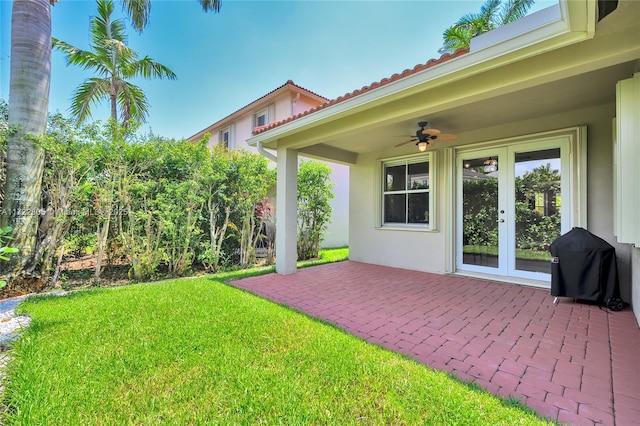 1632 NE Winterberry Ln, Weston, FL 33327 - view of yard featuring a ceiling fan, french doors, and a patio