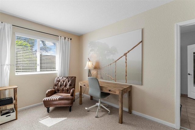 home office with baseboards and carpet floors