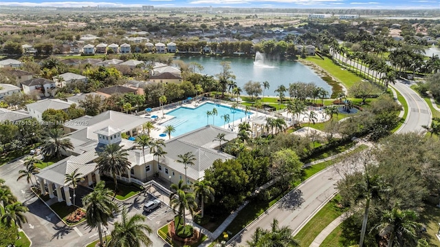 drone / aerial view with a residential view and a water view