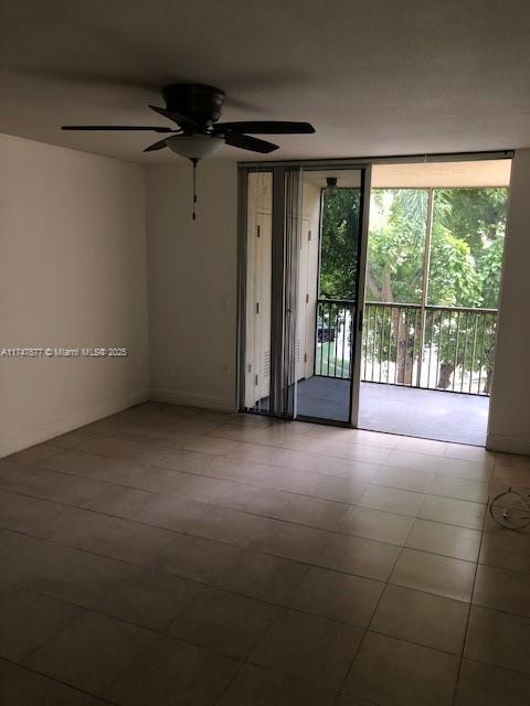 8353 Lake Dr Unit 302, Doral, FL 33166 - spare room with a wall of windows