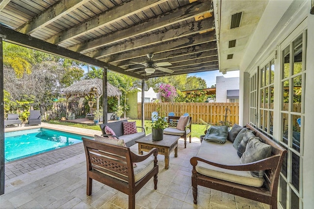 view of patio with a fenced backyard, an outdoor hangout area, a ceiling fan, a gazebo, and a fenced in pool