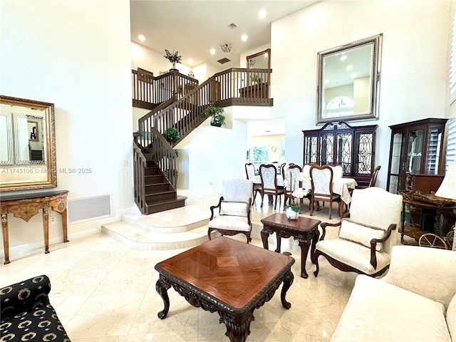 living room featuring a high ceiling